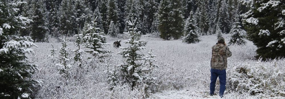 A man standing in a winter scene.