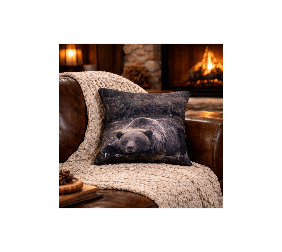 A rustic living room with a grizzly bear decorative throw pillow cover from our wildlife photography on leather sofa.