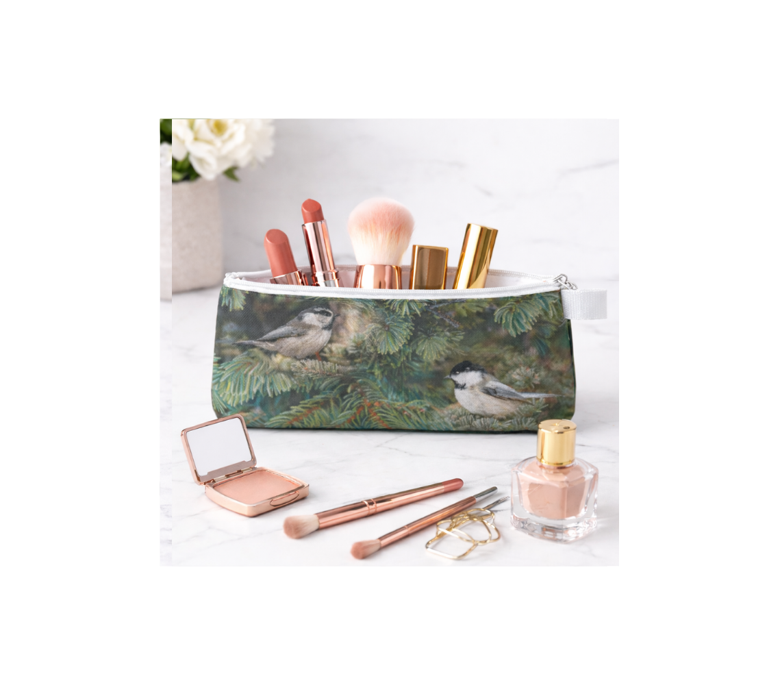 Zippered pouch with makeup inside it with chickadee design.
