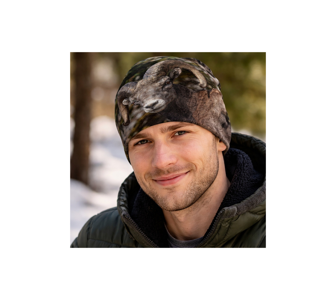 A Man in a forest wearing a bamboo- lined beanie with our photograph of a bighorn ram design with a green and gray background..