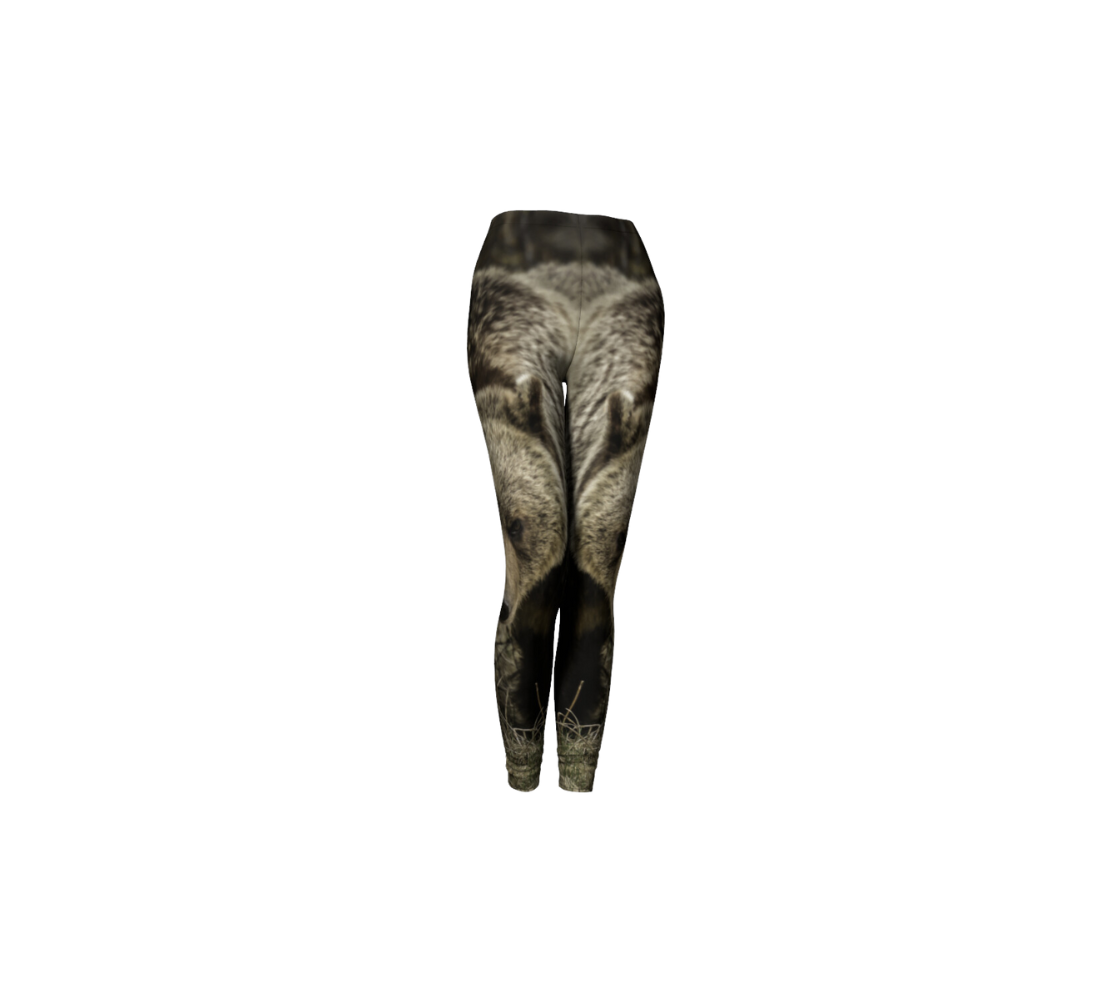 This is a front profile of a pair of classic leggings featuring a photo of a grizzly bear on each leg, with a 1.5 inch wide elastic waistband. The image is a close up of a large multi-colored brown girzzly bear coming towards you.