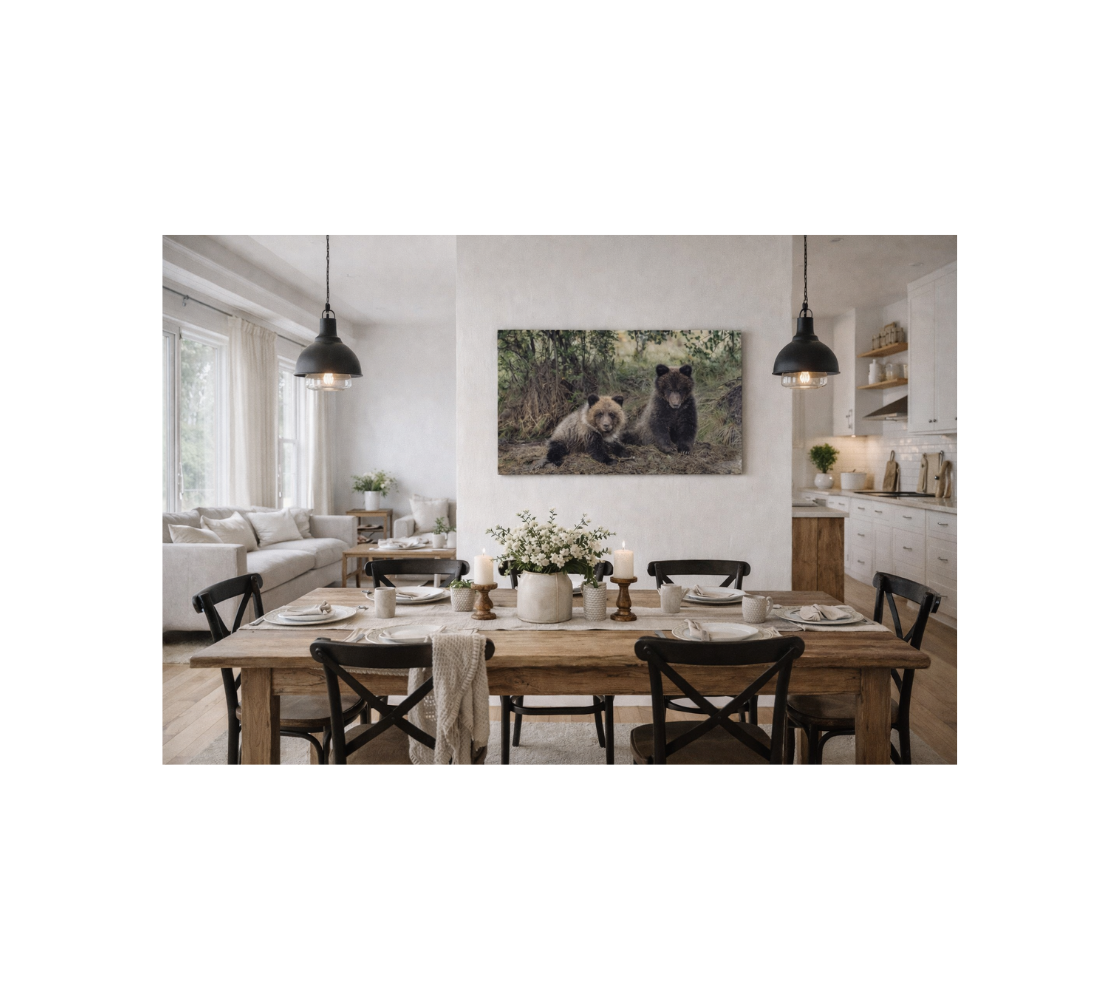 Dinning room with a canvas print hanging on wall of two grizzly Bear cubs.