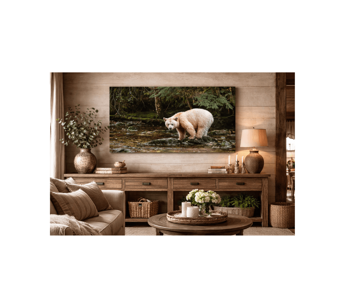 A living room with a canvas print of a spirit bear from our wildlife photography hanging on a wall above a side broad table.