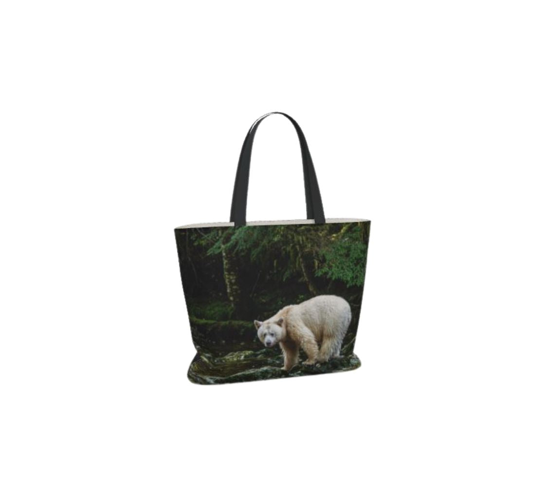 A large reusable large tote bag with an image of spirit bear design with a green background.