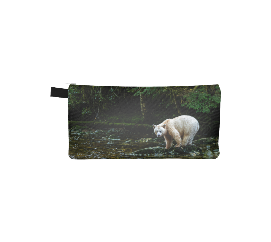This is a photo of a white spirit bear on a canvas zippered pouch. It is standing on a moss covered rock in a flowing stream. Background is green forest trees with dark shaded areas