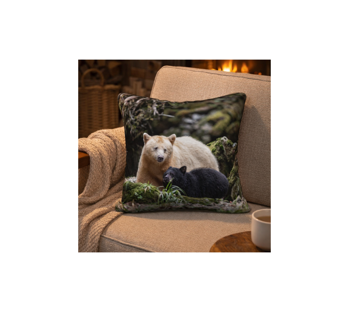 Decorative cushion cover with spirit bear and black cub design on a beige.
