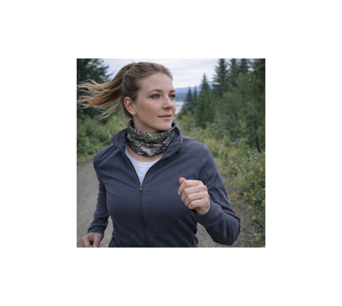 A woman jogging and wearing a head and neck buff with a image of a wolf around her neck.
