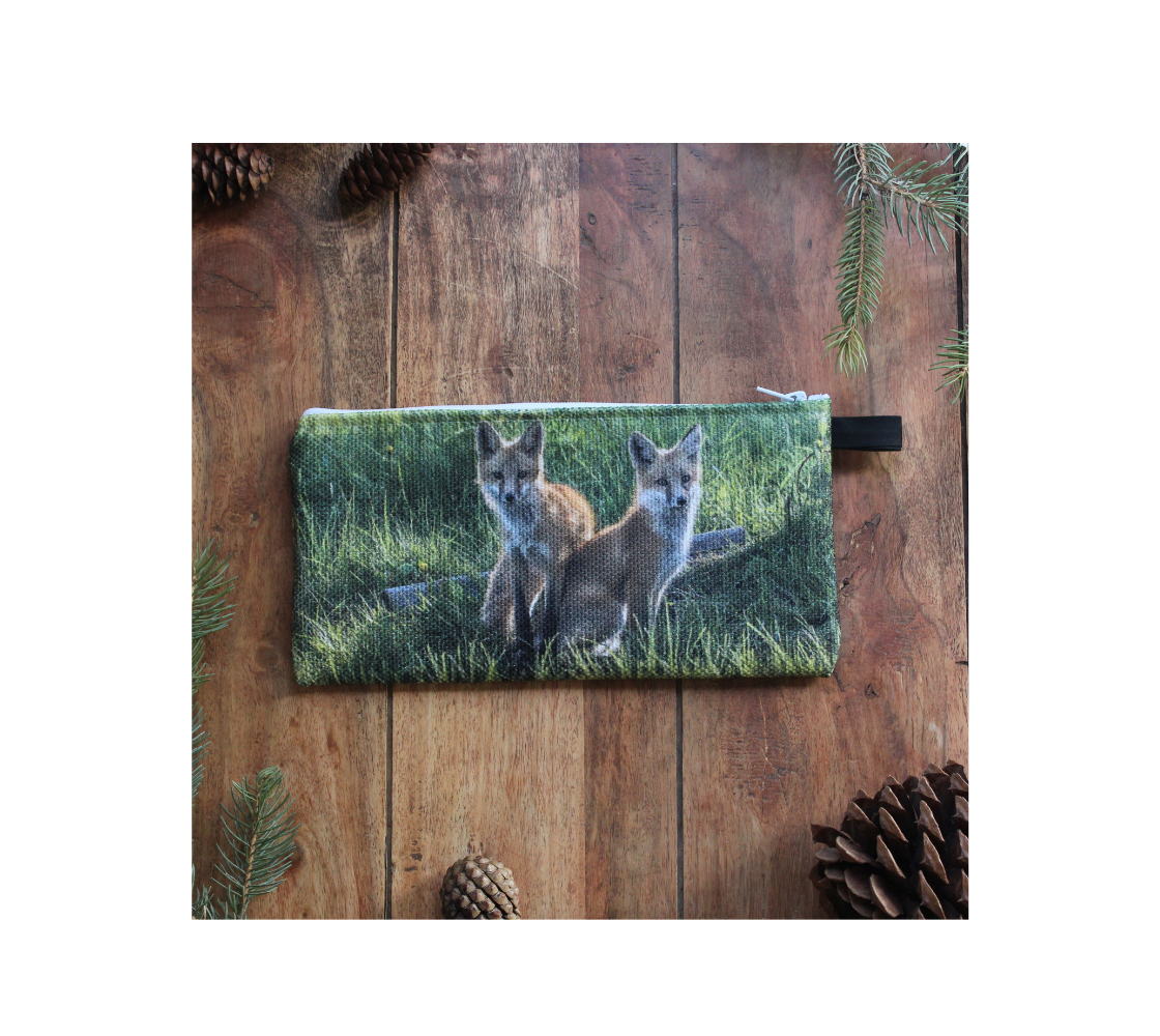 Durable double sided 9” x 4” canvas zippered pouch featuring real images of red fox kits.