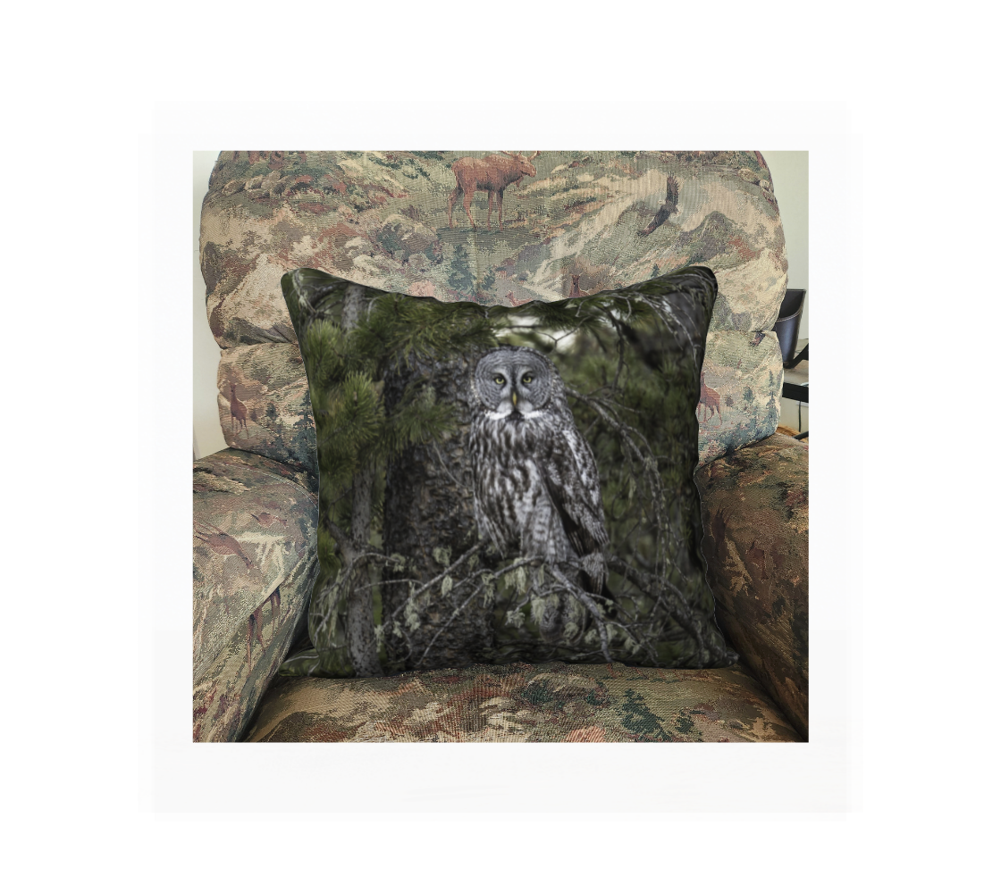 A Canadian-made soft plush velveteen cushion cover featuring a real North American wildlife image of a great grey owl. Solid black velveteen on the reverse side with a durable hidden zipper. Measures 18” x 18”.