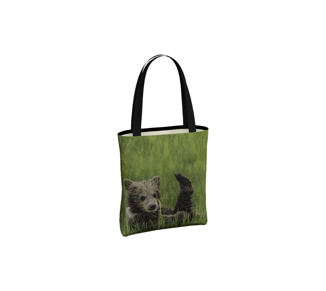 A brown bear cub medium tote bag from our real wildlife photography.
