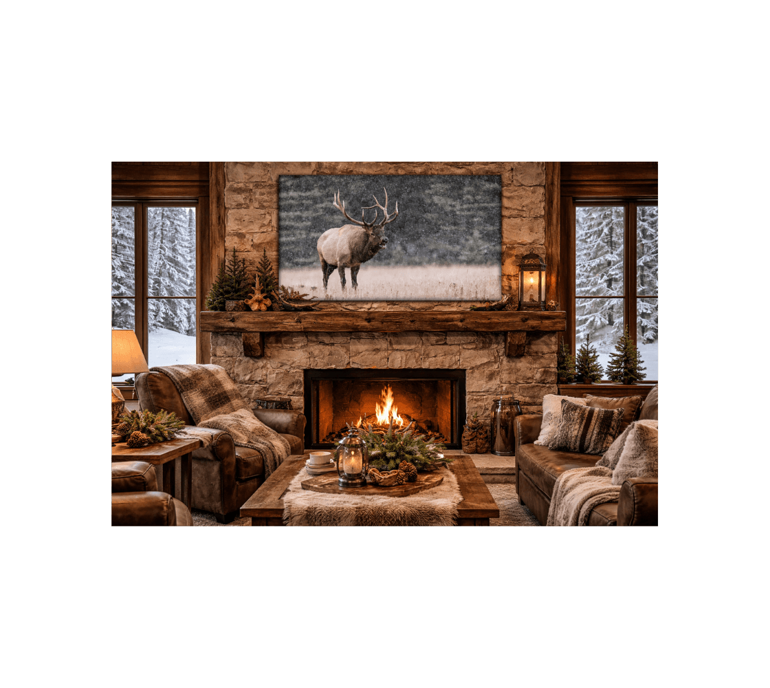 A cozy living room with a canvas print of a bull elk from our wildlife photography hanging above the fireplace.