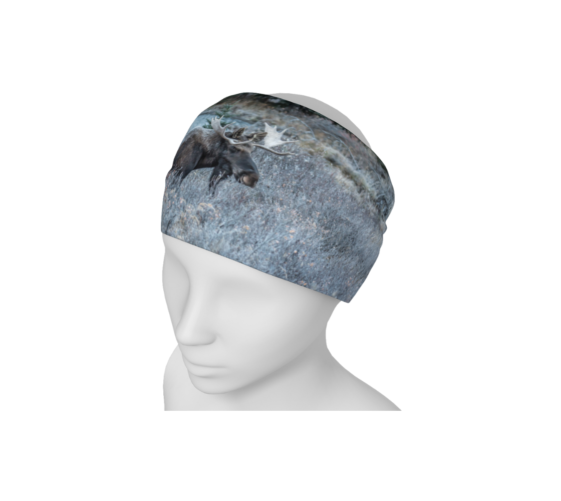 A mannequin head wearing a head and neck buff with an image of a bull moose design with a blue and green background.