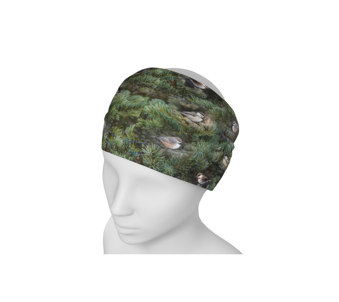 This is an image of a photo collage of chickadees on a head and neck buff worn as a headband on a mannequin. The fabric print is of green tree boughs in the background with a repeating collage of the four different chickadees of Western Canada in their colorful black, brown, white, rust and grey tones.