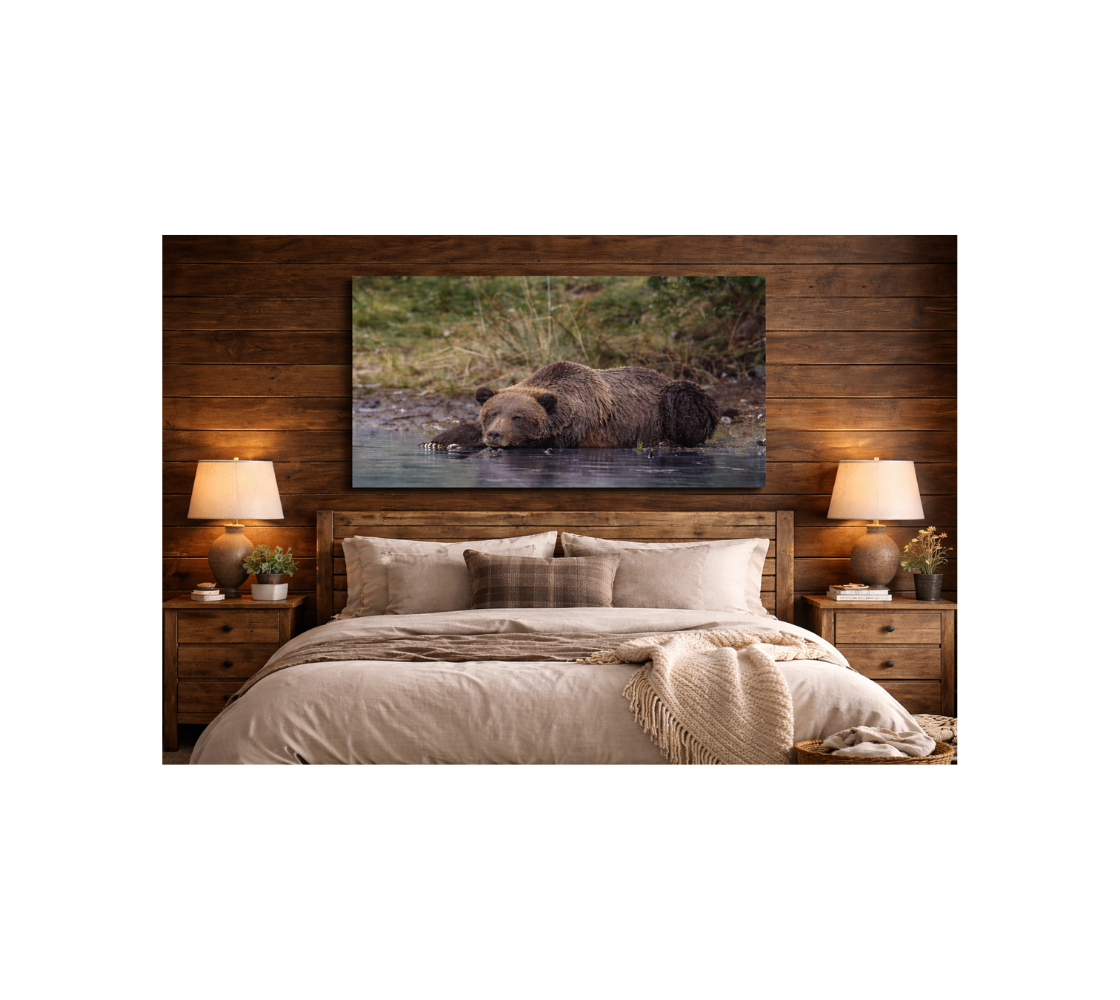 Bedroom with a canvas print of a grizzly bear hanging above the headboard.