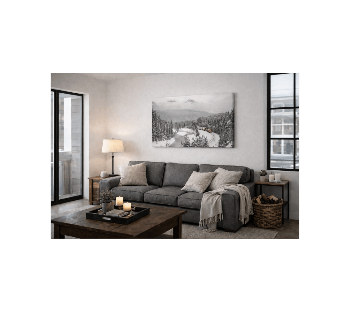 A living room with a canvas print of a  train coming around Morant's Curve from our nature photography hanging on a white wall.