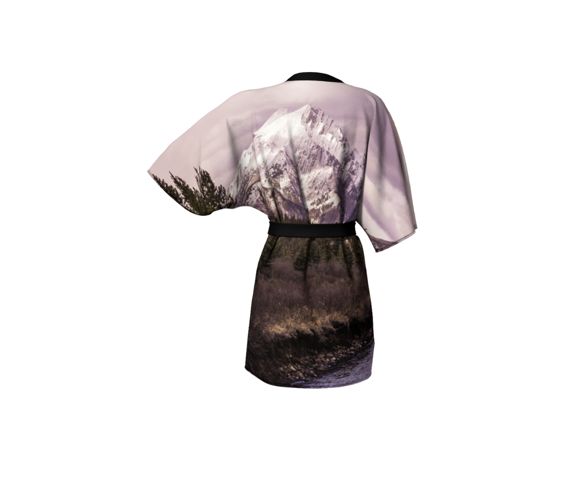 A back view of a kimono cover up with an image of pink mountain sunset design 