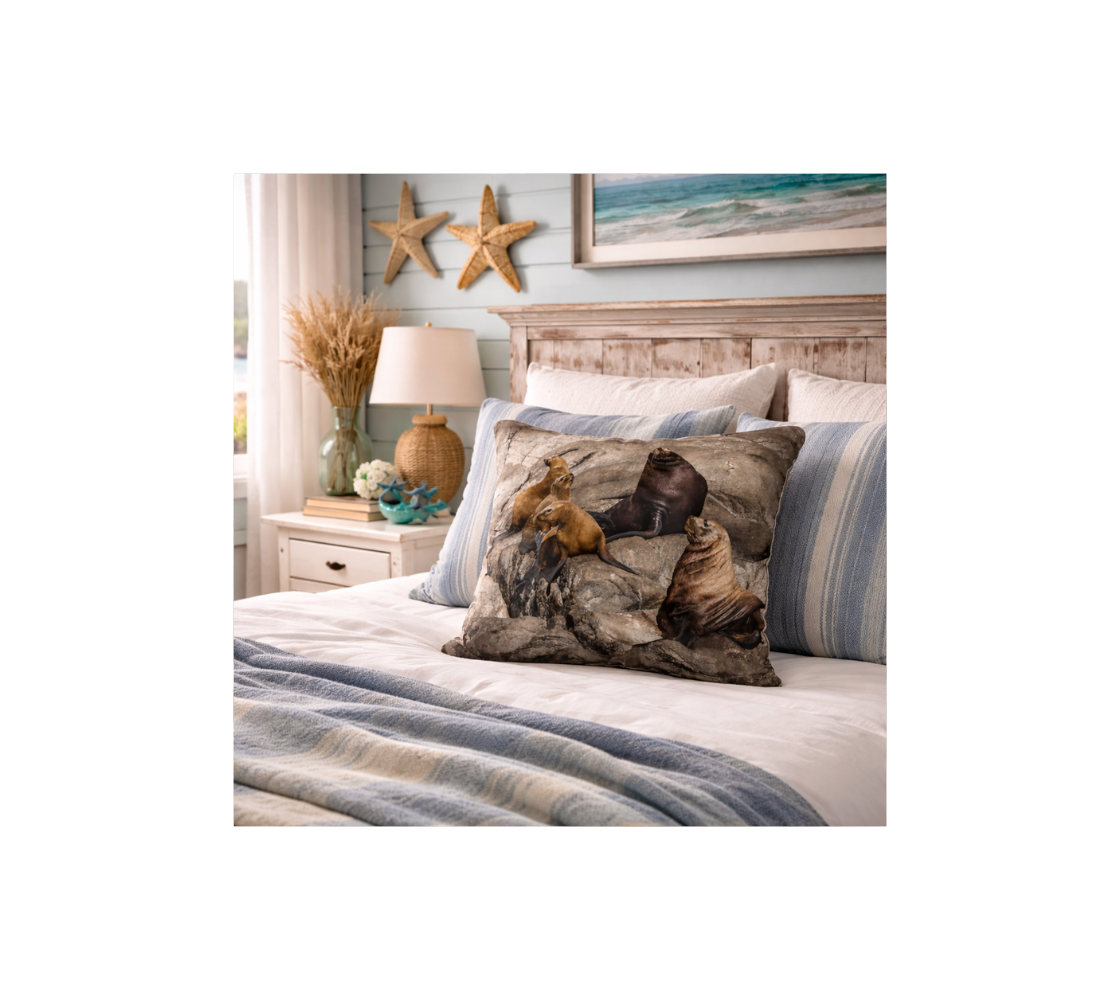 Bedroom setting with a bed and a throw pillow cover featuring an image of a group of sea lions design with a brown background.