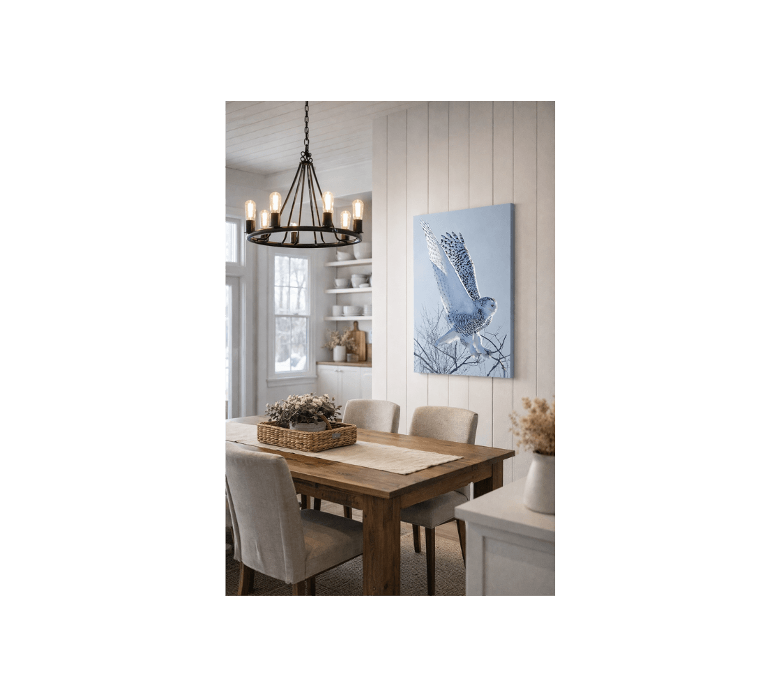 Dining room with snowy owl canvas print from our real wildlife photography hanging a wall.