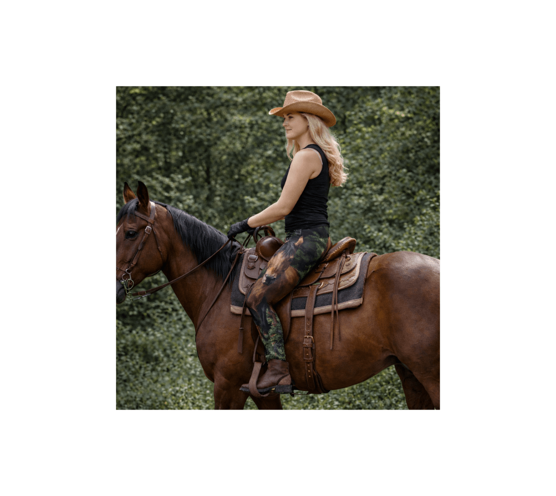 A woman riding a horse wearing a pair of wild horses yoga leggings from our real wildlife photography in a forest.