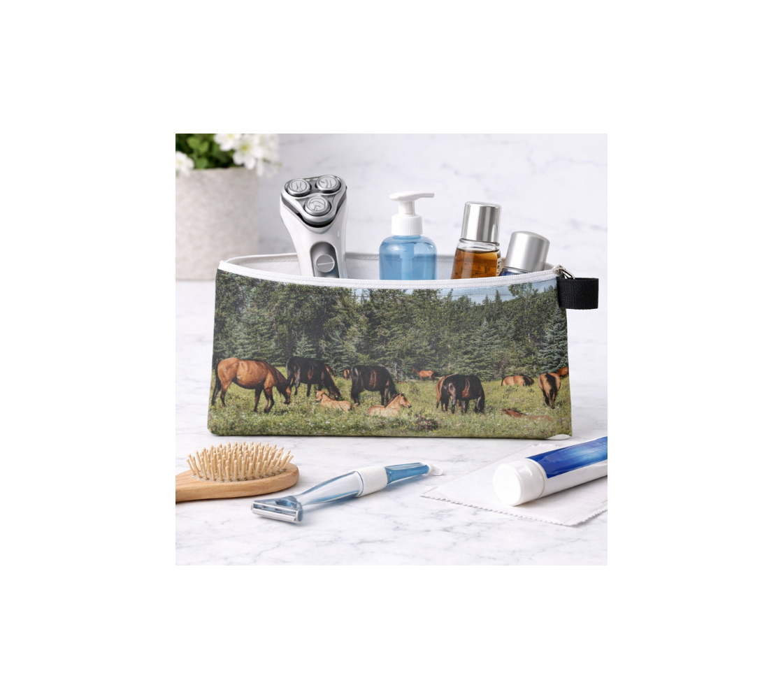A zippered pouch with an image of wild horses design with a green background with toiletries inside it. 