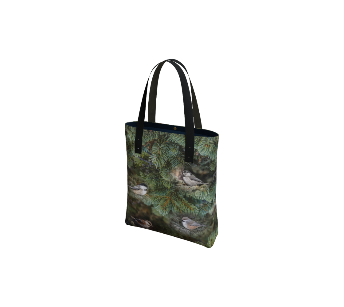 Durable canvas handbag with 1” vegan leather straps and magnetic closure with inside pockets. Features double sided real images of the four different chickadees of western Canada. Measures 16” x 13” x 3”.