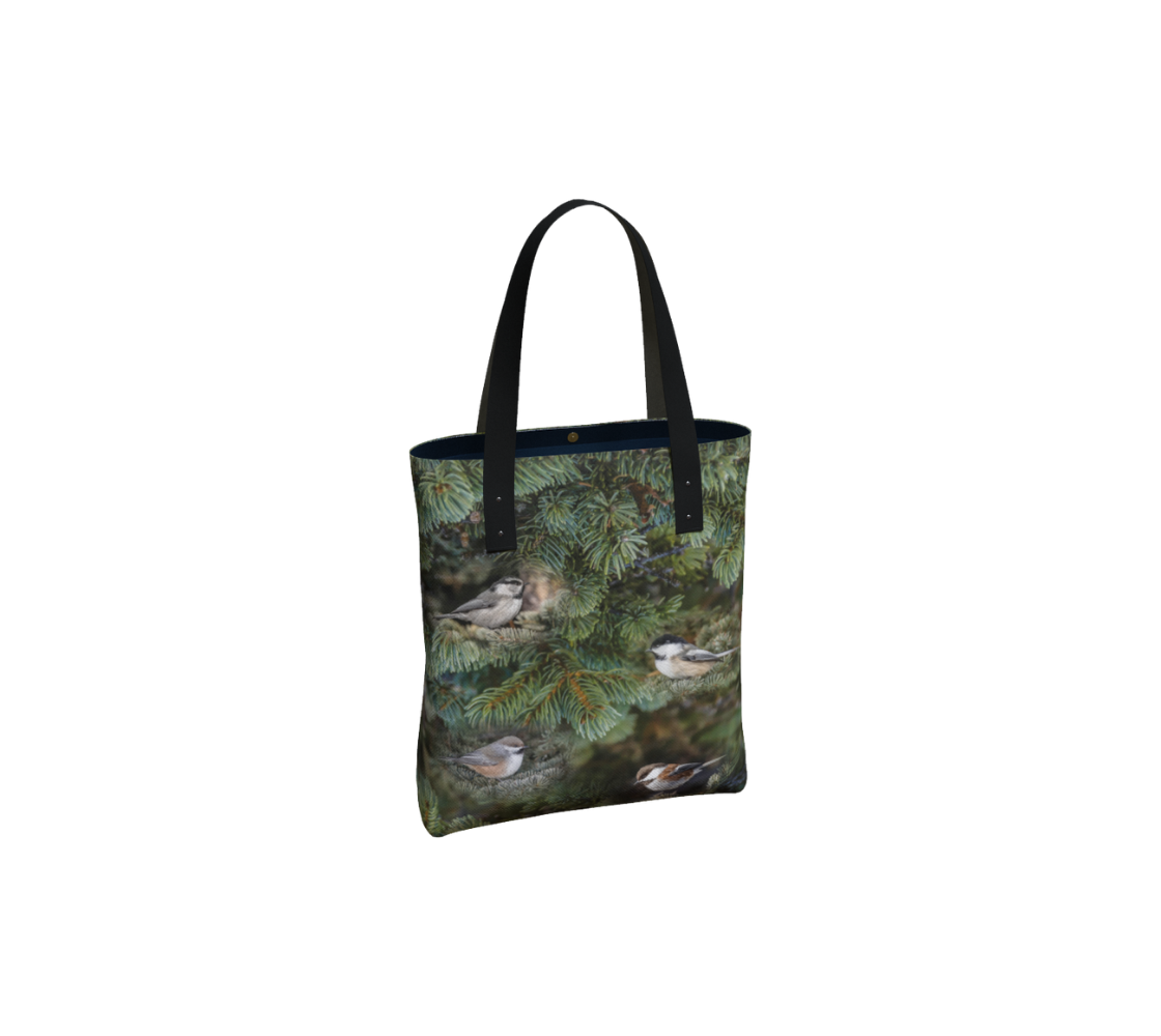 Durable canvas handbag with 1” vegan leather straps and magnetic closure with inside pockets. Features double sided real images of the four different chickadees of western Canada. Measures 16” x 13” x 3”.