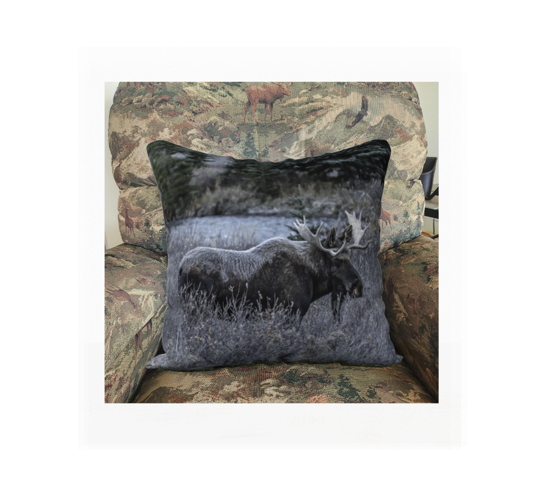 A Canadian-made soft plush velveteen cushion cover featuring a real North American wildlife image of a bull moose. Solid black velveteen on the reverse side with a durable hidden zipper. Measures 18” x 18”.