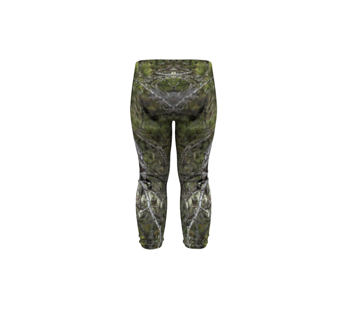 This is a rear profile of a pair of baby leggings featuring a photo of a great gray owl with green background.