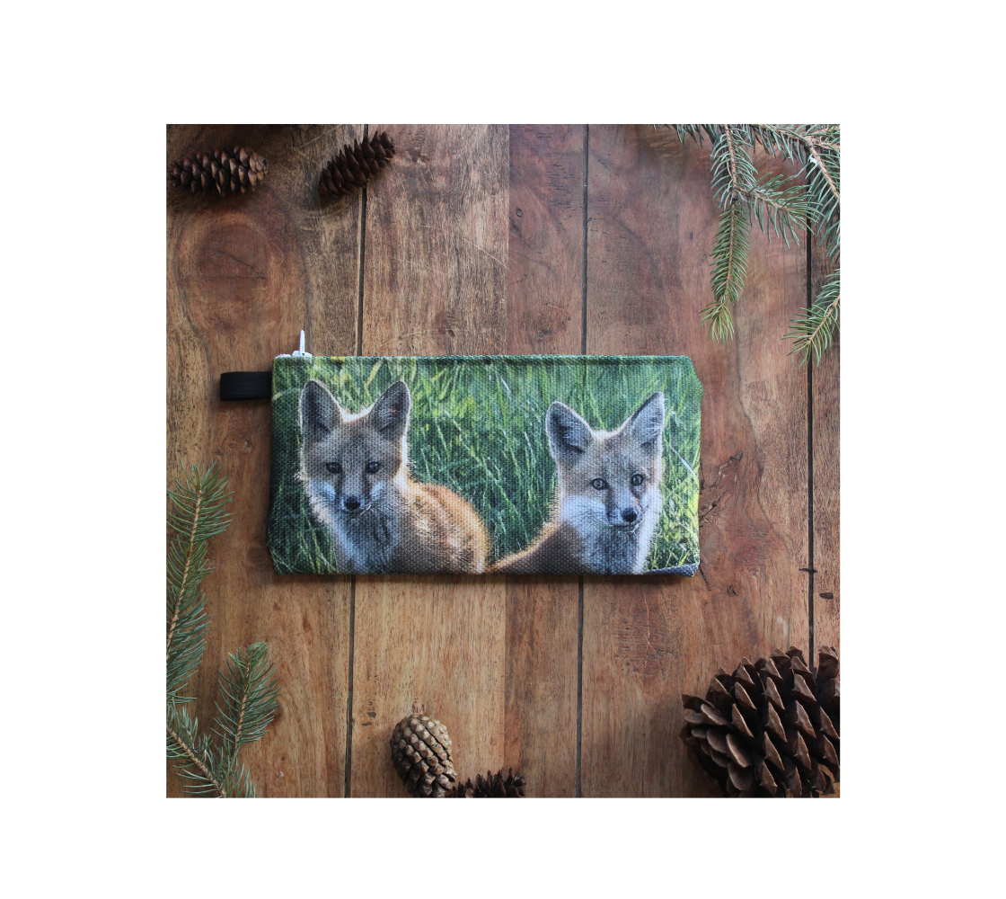 Durable double sided 9” x 4” canvas zippered pouch featuring real images of red fox kits.