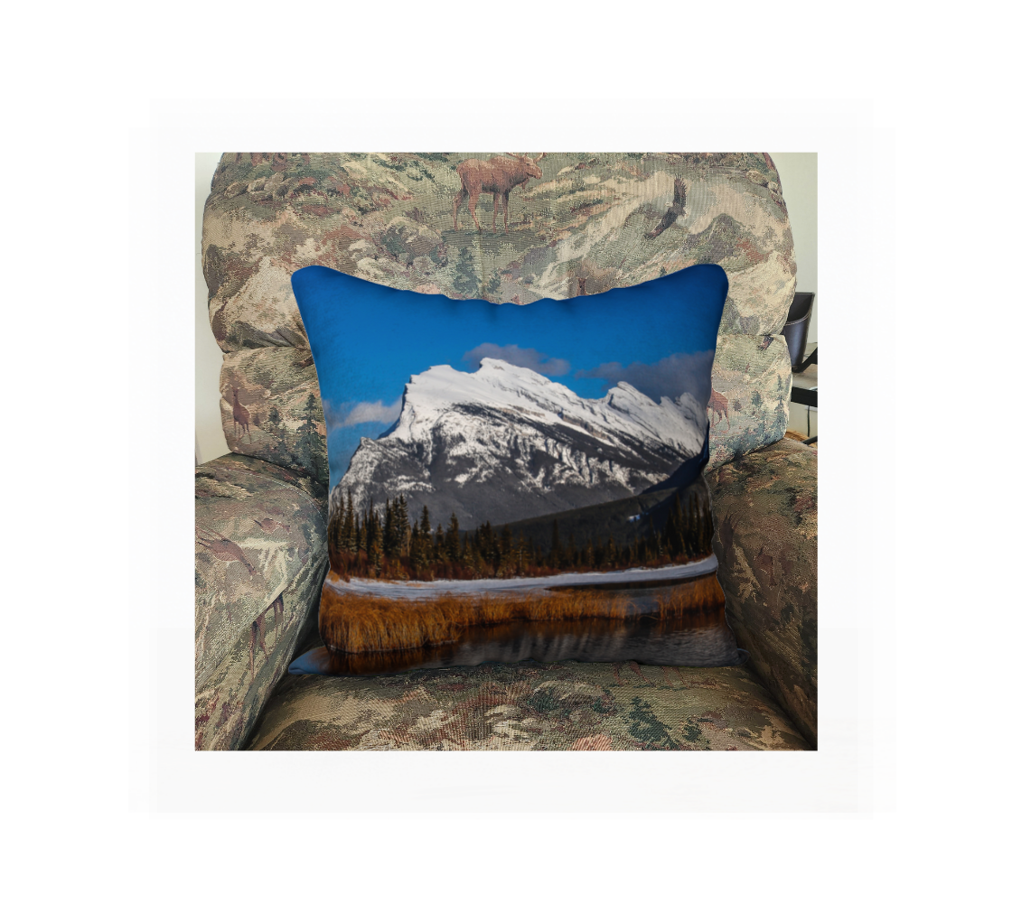 A Canadian-made soft plush velveteen cushion cover featuring a real North American wildlife image of a mountain scene. Solid black velveteen on the reverse side with a durable hidden zipper. Measures 18” x 18”.