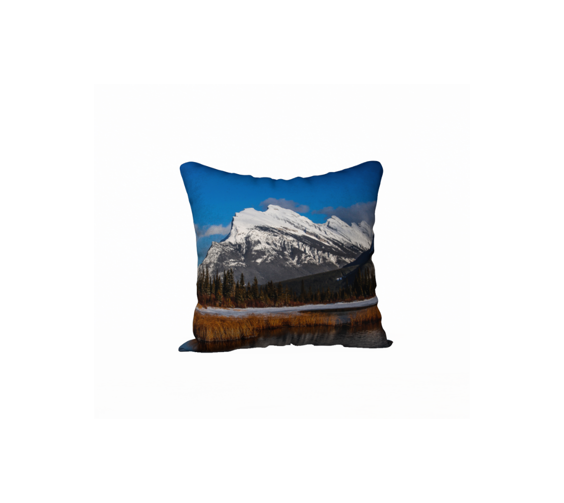 A Canadian-made soft plush velveteen cushion cover featuring a real North American wildlife image of a mountain scene. Solid black velveteen on the reverse side with a durable hidden zipper. Measures 18” x 18”.