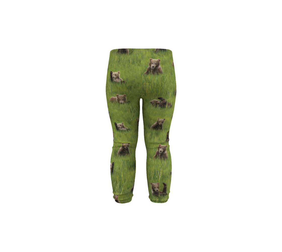 Made from 88% polyester and 12% spandex, these durable ultra stretch leggings feature real North American wildlife images of adorable grizzly bear cubs. Designed with a slim fit, with a 1” wide elastic waistband, the little ones will stand out from the crowd in style and comfort with this unique vivid print that will never fade. 