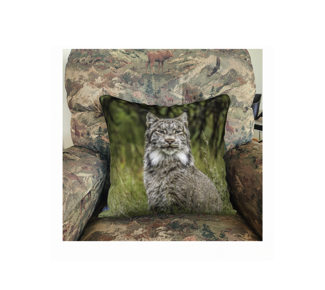 A Canadian-made soft plush velveteen cushion cover featuring a real North American wildlife image of a Canadian Lynx. Solid black velveteen on the reverse side with a durable hidden zipper. Measures 18” x 18”.