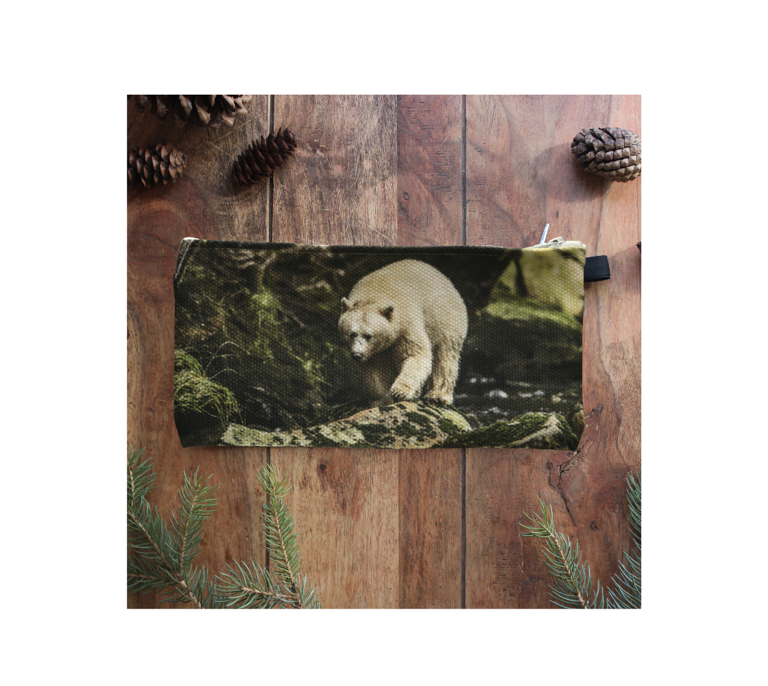 Durable double sided 9” x 4” canvas zippered pouch featuring real images of spirit bear walking on rocks.