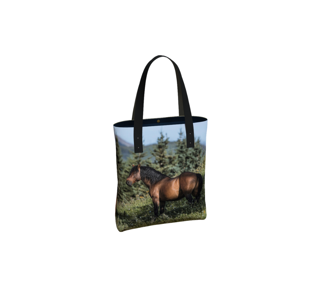 Durable canvas handbag with 1” vegan leather straps and magnetic closure with inside pockets. Features double sided real images of Wild horses of Alberta foothills Measures 16” x 13” x 3”.