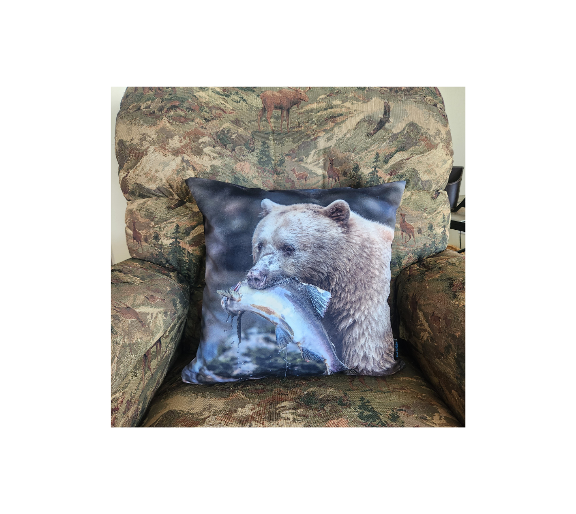A Canadian-made soft plush velveteen cushion cover featuring a real North American wildlife image of a spirit bear. Solid black velveteen on the reverse side with a durable hidden zipper. Measures 18” x 18”.