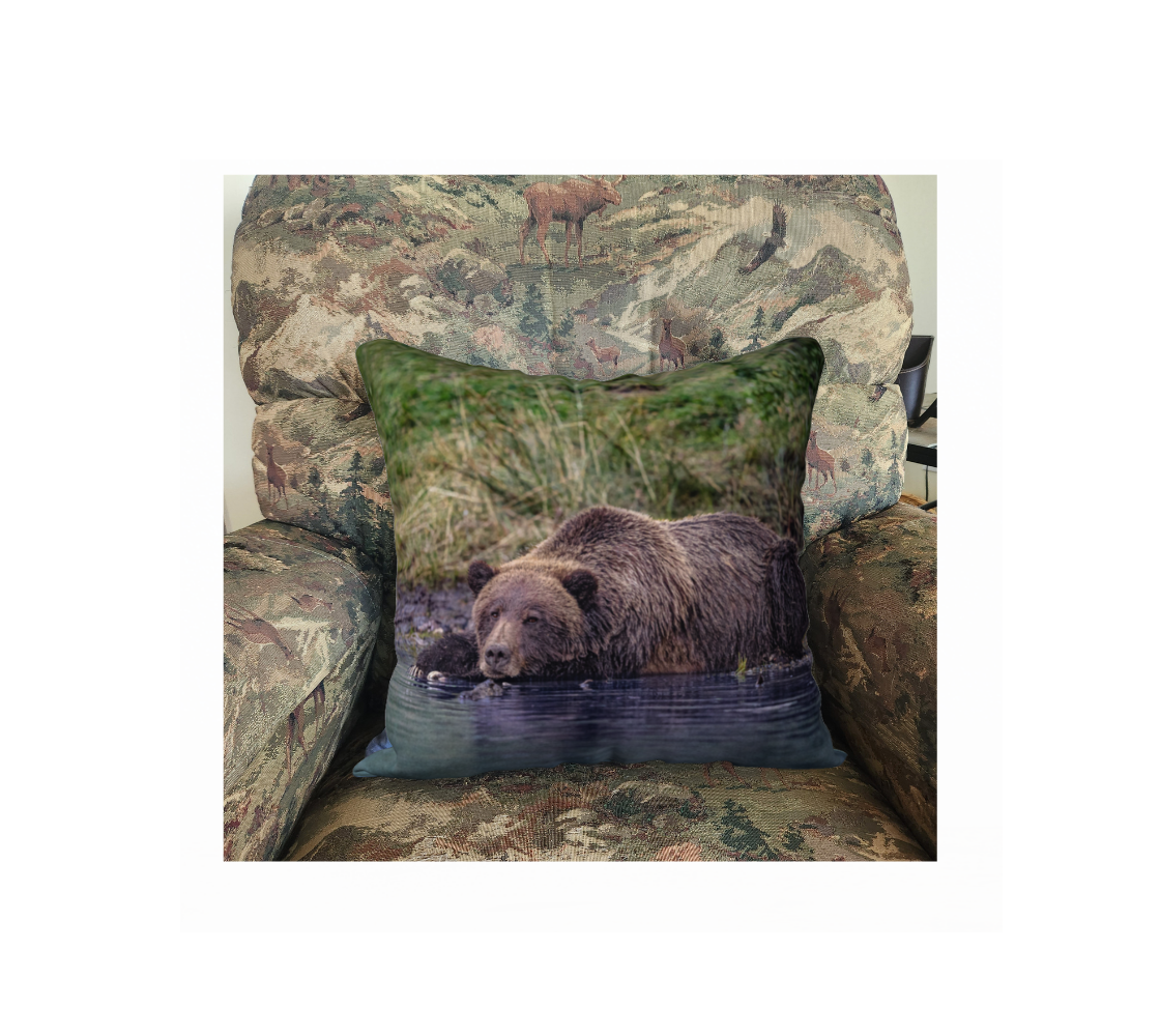 A Canadian-made soft plush velveteen cushion cover featuring a real North American wildlife image of a grizzly bear. Solid black velveteen on the reverse side with a durable hidden zipper. Measures 18” x 18”.