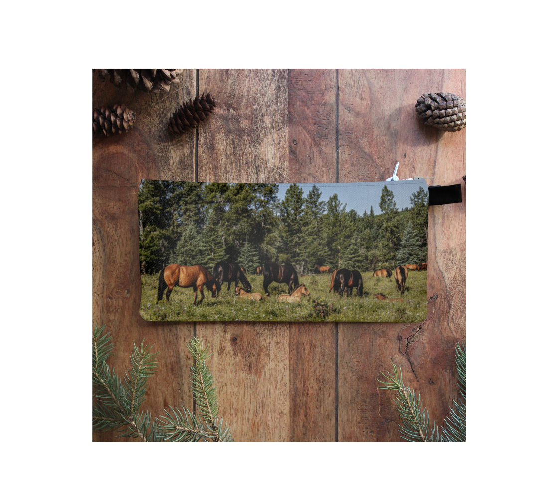 Durable double sided 9” x 4” canvas zippered pouch featuring real images of wild horses in foot hills of Alberta.